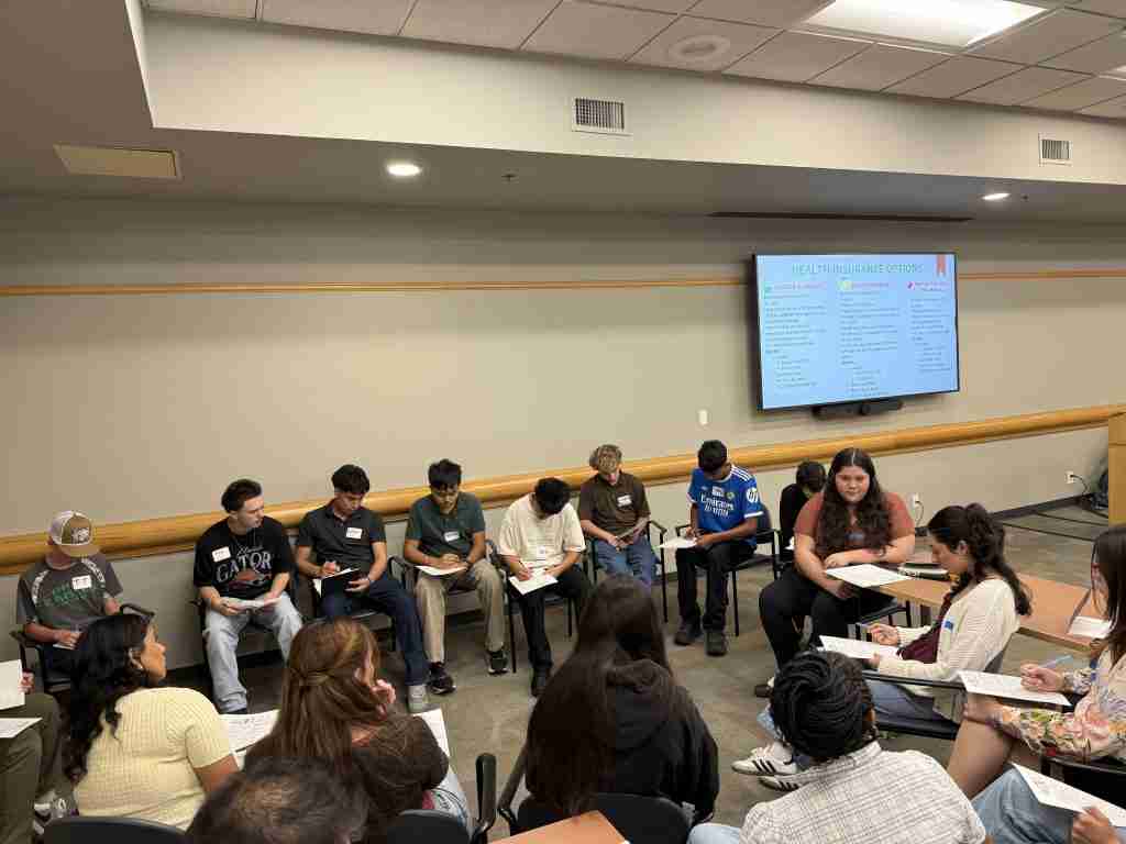 Future Leaders Game of Life group works to calculate expenses